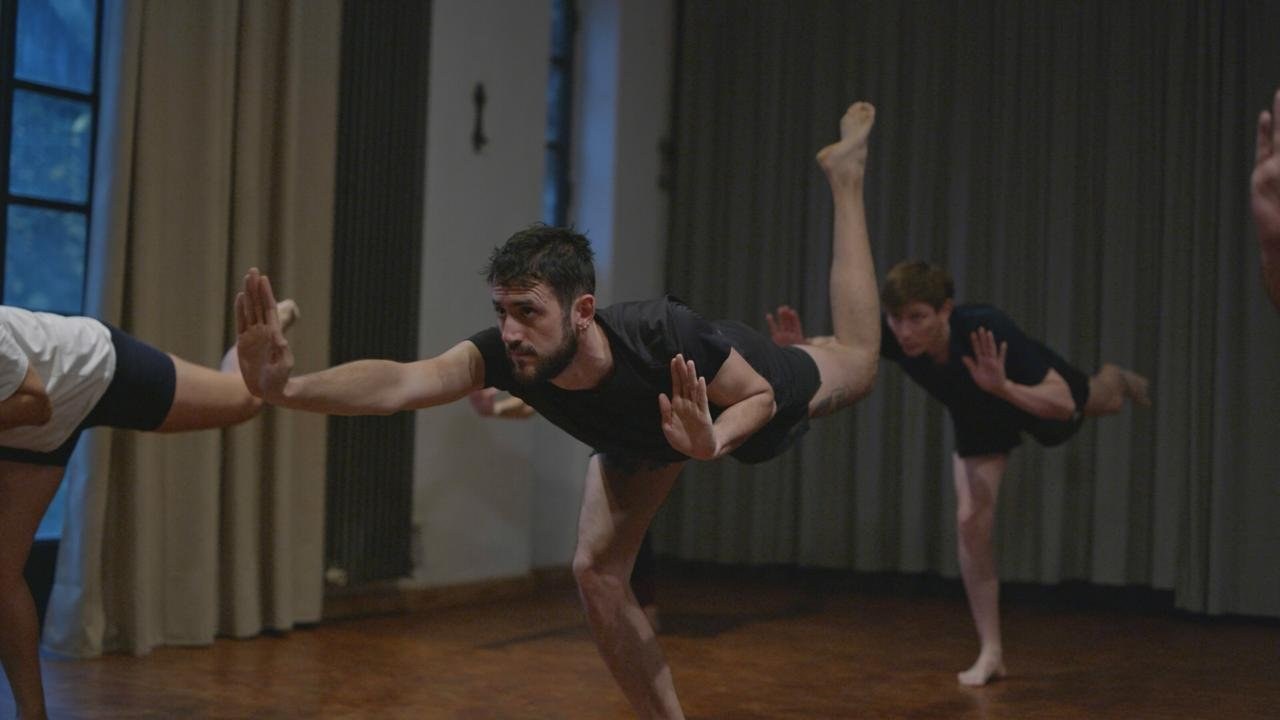 Students training a posture together during a Berlin Kalaripayattu class
